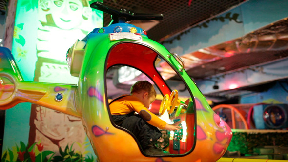 Boy in Amusement Helicopter 2 alt