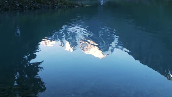 Lake And Peaks Reflecting In The Water