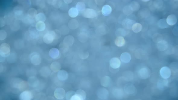 Abstract background of blue bokeh spinning