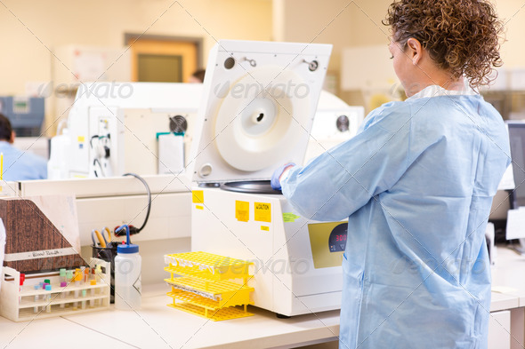 Scientist Using PCR Machine In Laboratory - Stock Photo - Images
