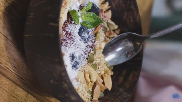 Closeup of Child Eating Smoothie Bowl alt