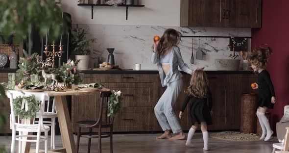 Dancing Young Mother Daughters Having Fun Festive Holidays Together Xmas Decorated Kitchen