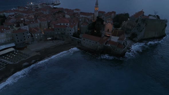 Aerial View of Coastal Old Town Budva with Medieval Buildings at Dusk