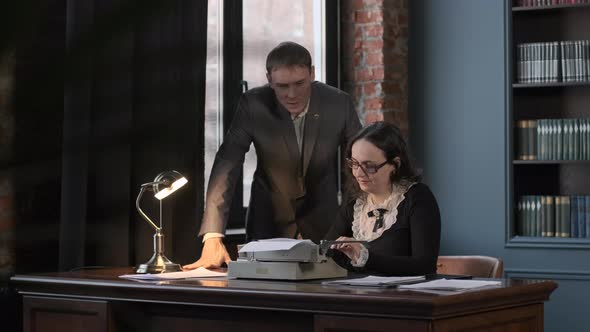 Secretary Typing Text Which Dictates Her Boss alt