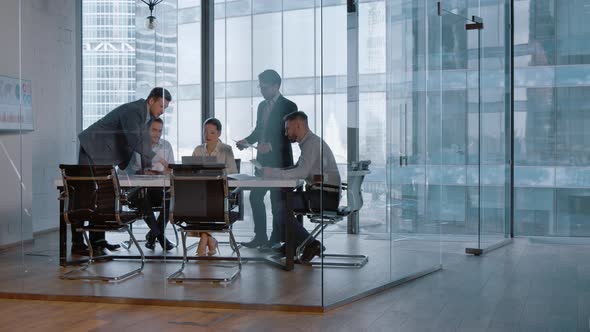 Corporate leader handing out statistics of the company's financial development strategy alt