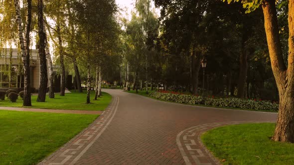 Walk in a Park on Cobblestone Sidewalk alt