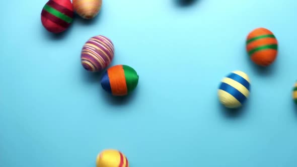 Colorful Easter Egg Made From Threads Isolated on Blue Background