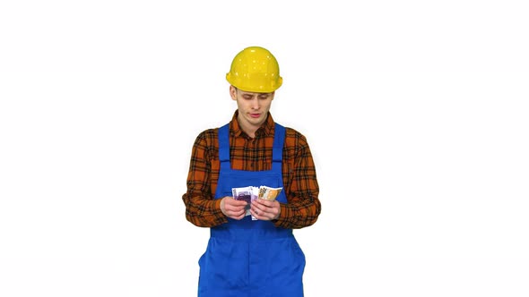 A Workman Counting Cash in Exaggerated Way and Dancing After That on White Background. alt