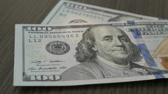 Counting American paper currency 4K 2160p 30fps UltraHD footage - Lot of hundred dollar bills fall o alt