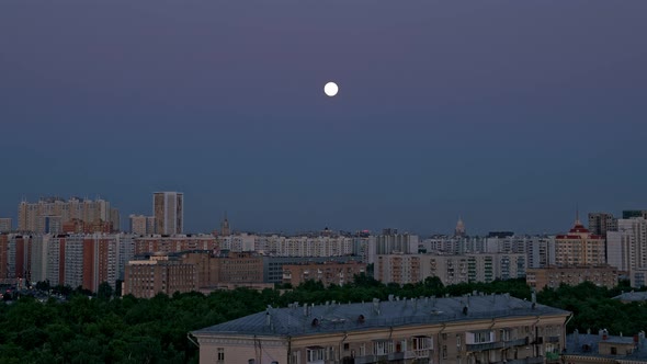 Timelapse of Moon Moving Over the City Background, Moscow  alt