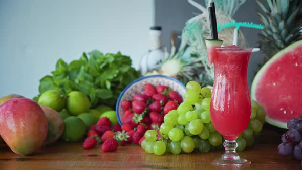 Wide shot of freshly made smoothies and tasty juicy fresh fruits. Healthy eating options. alt