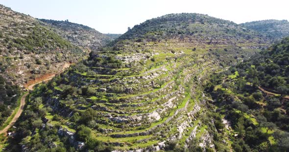 Aerial View of natural formation in the hills with paths, al-Bireh Governorate. alt