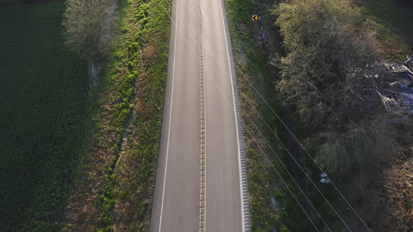 Aerial Top Down Drone Footage of Empty Open Country Road alt