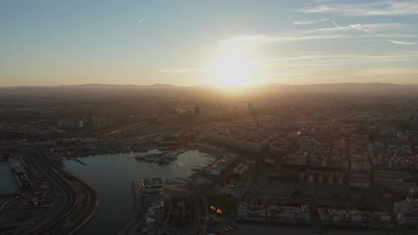 Aerial View of the Container Terminal of the Seaport of the City of Valencia and the Ship During