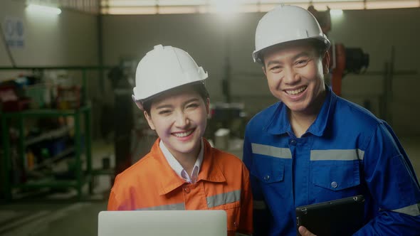 portrait of asian emgineer male female technician in safty uniform