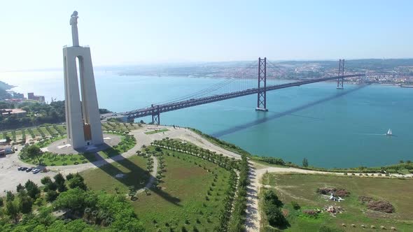 Aerial view of Sanctuary of Christ the King overlooking Lisbon and 25 de Abril Bridge connecting Lis alt