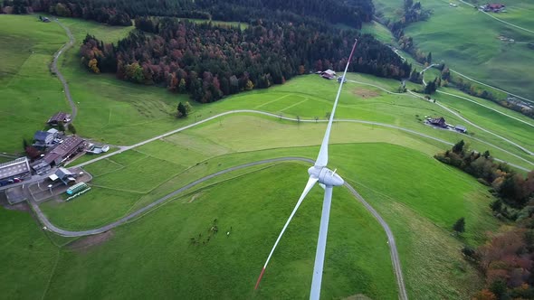 Aerial video of a wind turbine from above in Entlebuch, Switzerland alt