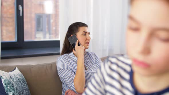 Mother Calling on Phone and Son Learning at Home alt