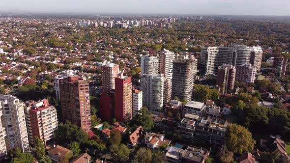 Aerial flyover San Isidro Residential Ares with high blocks and green trees during summer day in Bue alt