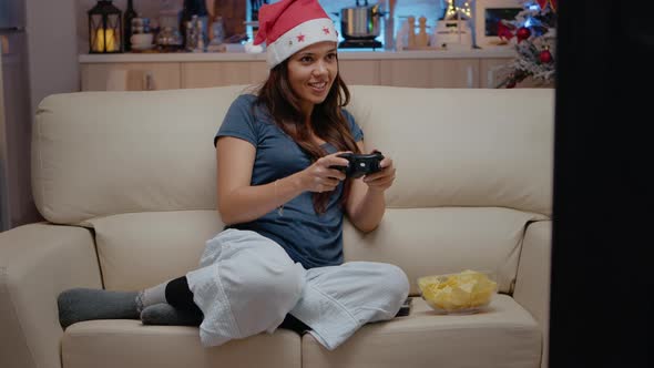 Woman Playing Video Games on Console with Controller alt