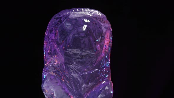 Close Up of a Lion Shaped Ice Sculpture in the Making Purple Light alt