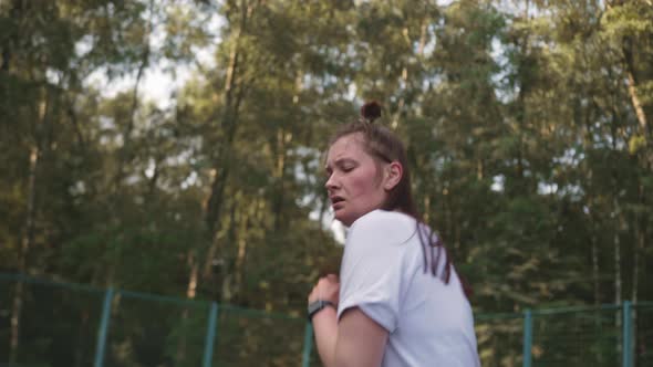 Woman in the Park on the Playground is Engaged in Active Cardio Workout alt