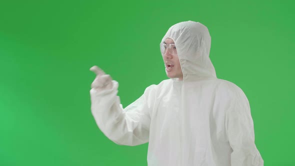 Side View Of Angry Asian Man Wear In The Green Screen Studio alt