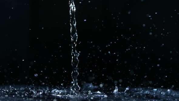 Pouring Water on Dark Background Shooted with High Speed Cinema Camera at 1000 Fps alt