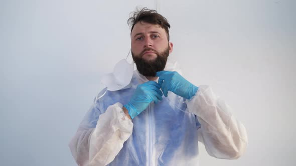 Doctor is Undressing After Work in Danger Zone with Covid19 Infected alt