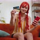 Woman Sit on Couch Using Credit Bank Card and Smartphone While Transferring Money Online Shopping - VideoHive Item for Sale