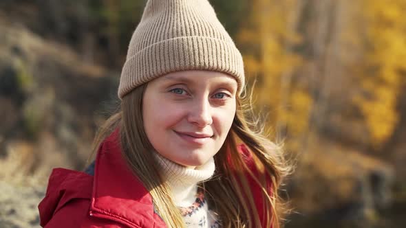 Caucasian Woman with Blue Eyes in Beige Hat Smiles Romantically alt