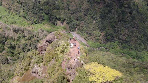 Aerial shot of tourists at Vereda dos Balcoes Viewpoint, Madeira, Portugal alt