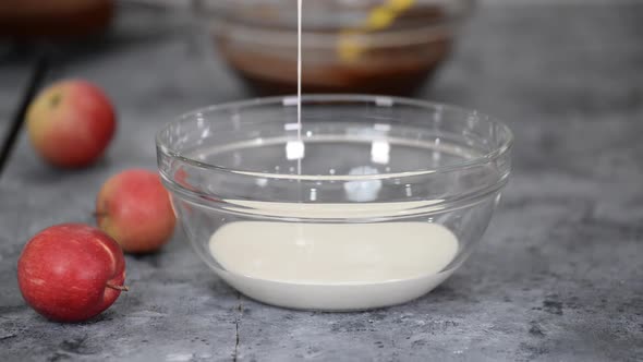 Woman Whip Heavy Cream with Hand Mixer alt