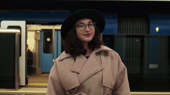 Portrait of a Beautiful Young Girl Looking Straight Into the Camera and Smiling alt