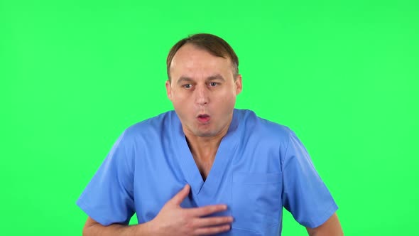 Medical Man Feels Bad, Her Stomach Hurts, Feeling Nausea. Green Screen alt