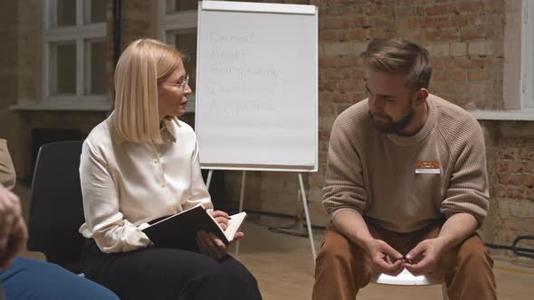 Alcoholic Man Talking to Female Psychologist alt