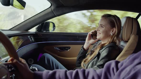 A passenger girl is talking on the phone