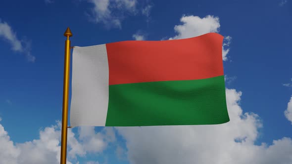 National flag of Madagascar waving with flagpole and blue sky timelapse alt