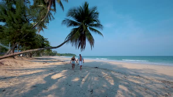 Couple on Vacation in Thailand Chumpon Province White Tropical Beach with Palm Trees Wua Laen Beach alt