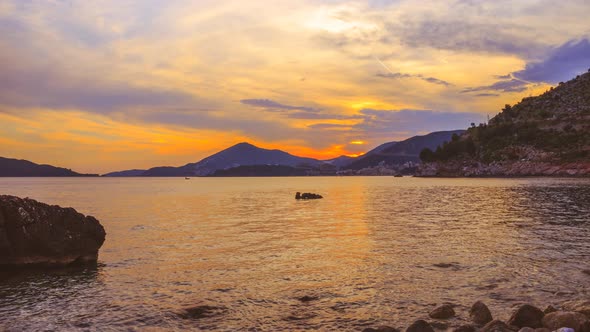 Time lapse, colorful sunset on Adriatic sea coastline,near the Budva city in Montenegro
