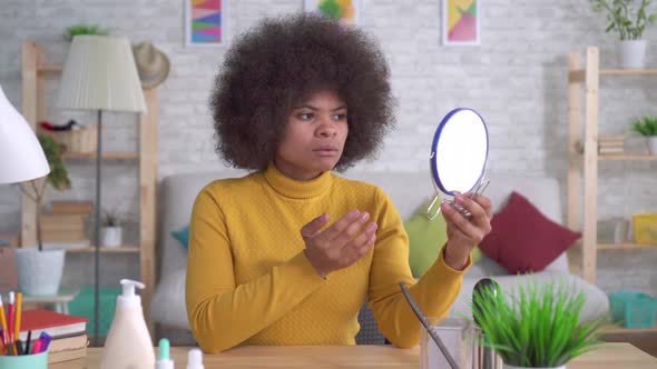 Portrait African American Woman with an Afro Hairstyle of That Unhappy Looking in the Mirror Finds a alt