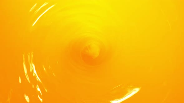 Super Slow Motion Shot of Orange Juice Whirl at 1000 Fps alt