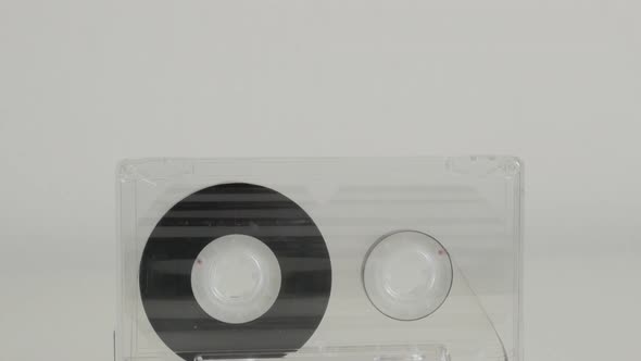 Transparent analogue  magnetic tape 4K 2160p 30fps UltraHD tilting footage - Compact  audio cassette alt