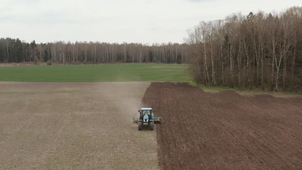 Tractor at Work in the Eco-Farming Field
