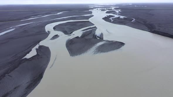 Flying Over a Large Icelandic Glacial River System and Black Volcanic Sediments, Iceland alt