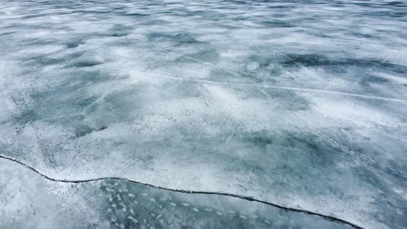 Flying above arctic ice floes, and icebergs. alt