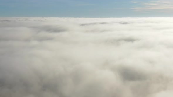 Aerial View Flying Above the Clouds