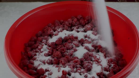 The Housewife Sprinkles Ripe Fresh Raspberries with Sugar to Make Jam