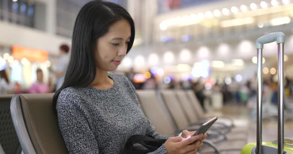 Woman Use of Mobile Phone in Airport 