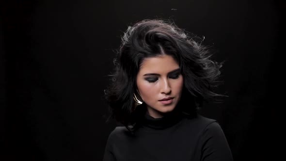 Beautiful Girl Looking at Camera in Studio